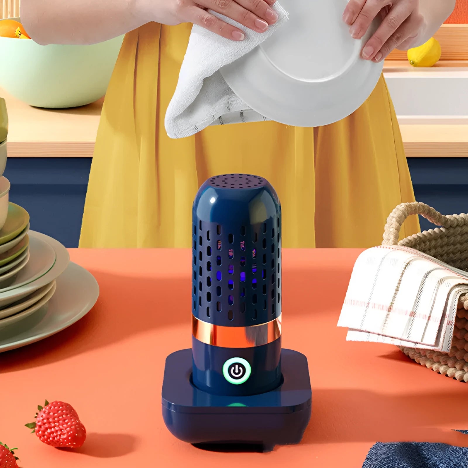 Blue capsule fruit and vegetable cleaner on a kitchen surface with USB charger