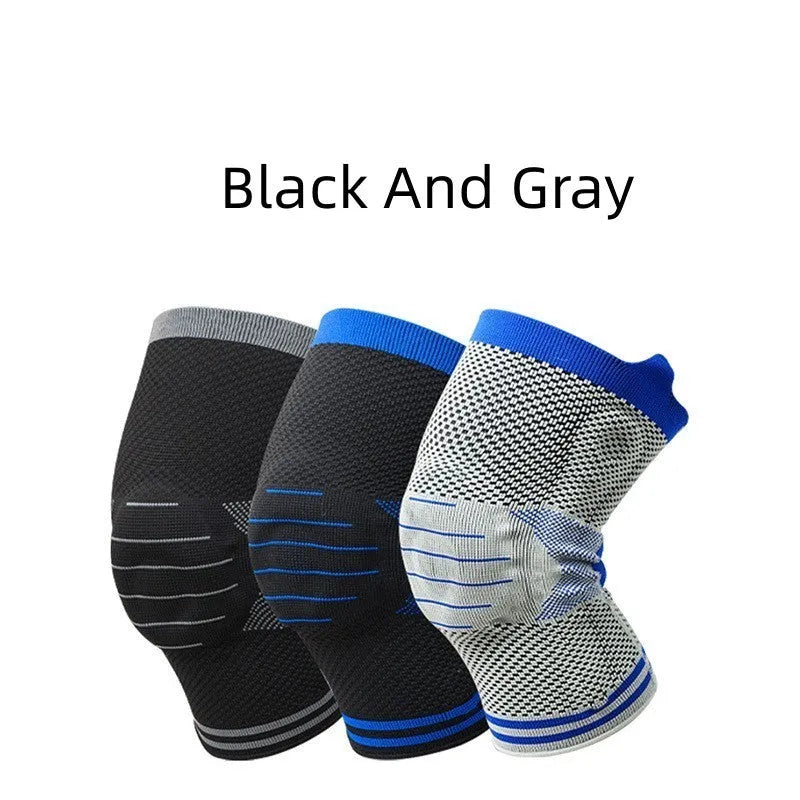 Close-up of a grey and blue cotton knee pad showing the silicone massage spring bar and shock absorber design.