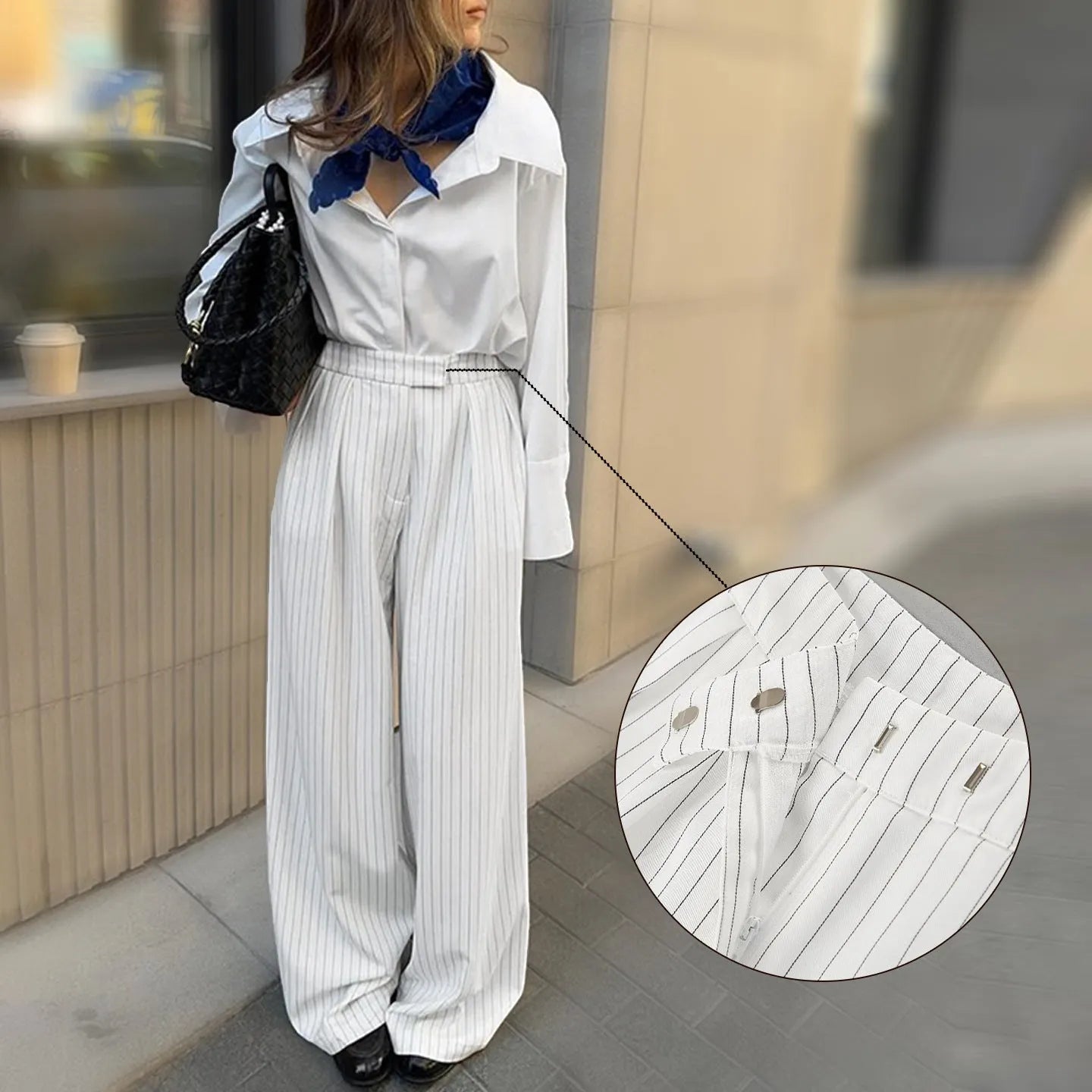Women's white striped wide-leg trousers with side zip on mannequin