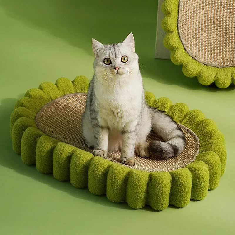 Green oval cat scratch pad bed with sisal scratching surface measuring 650x420mm
