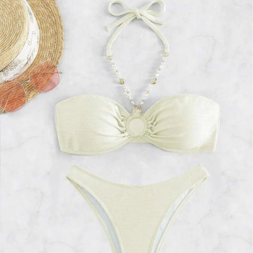 Women's halter neck bikini set in solid colour with brief bottoms for beach swimming