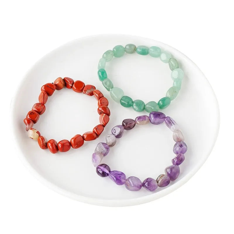 Natural amethyst large particle gravel rolling stone bracelet on a plain background showing smooth rounded beads