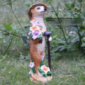 Straw hat wearing mongoose garden ornament in synthetic resin