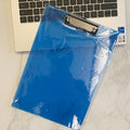 Transparent A4 plate holder with metal clip in blue, green, red, and white colour options