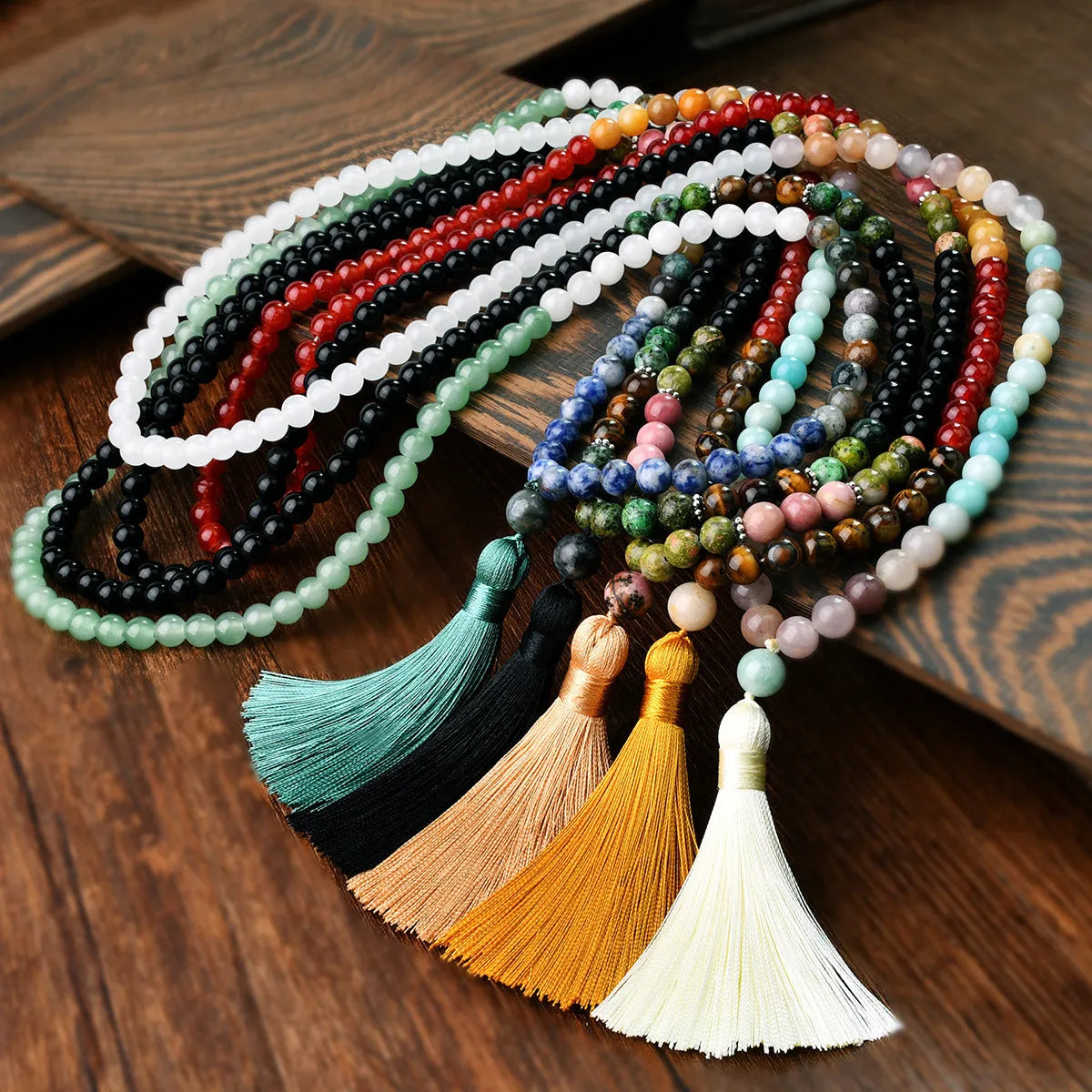 Long bohemian necklace with 108 stone tassels and a geometric gemstone pendant on an 81cm chain.