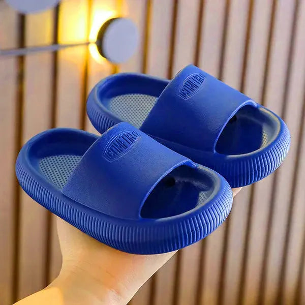 Children's colourful EVA slippers showing non-slip sole, available in blue, green, orange, pink, and yellow.