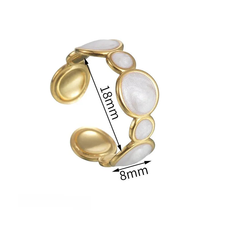 Silver geometric adjustable stainless steel ring for women on a plain background