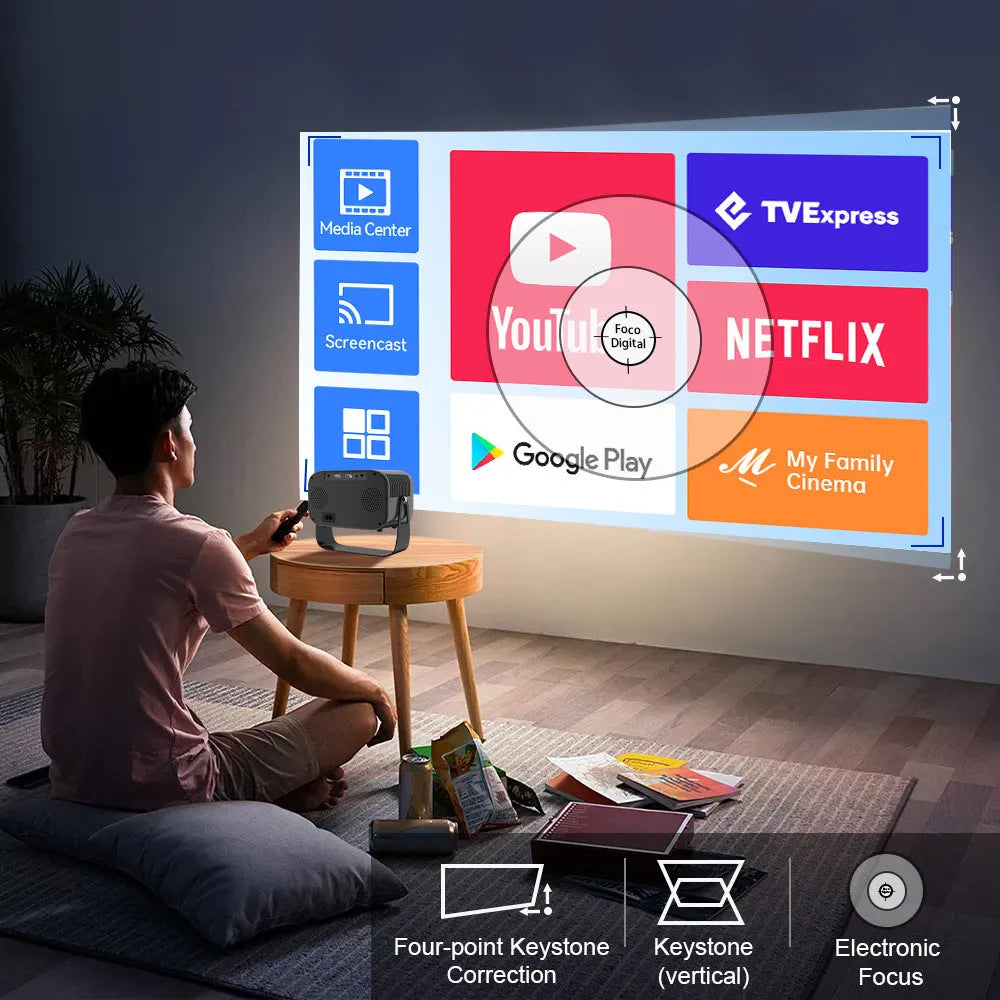 Matte black portable smart HD projector with remote control on wooden surface