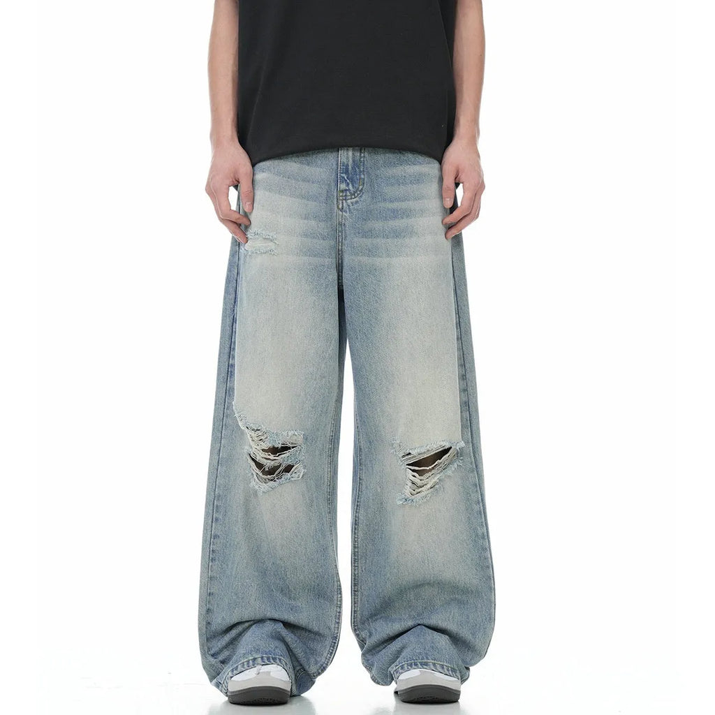 Blue straight-leg men's jeans with retro ripped detailing on cotton blend fabric