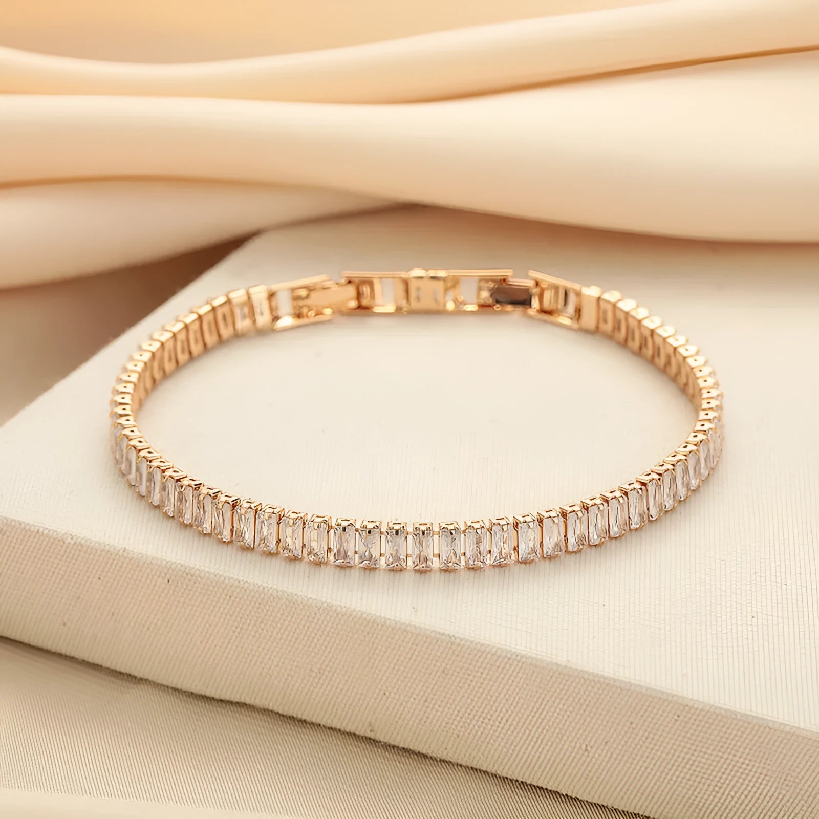 Rectangular geometric women's bracelet with full diamond zircon treatment in champagne gold colour