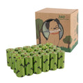Roll of army green degradable dog poop bags with black bone print, showing bag size scale