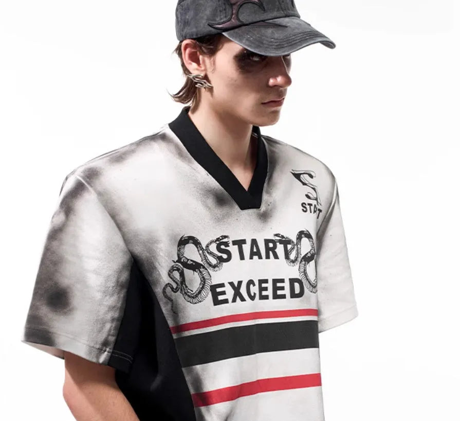 Women's short sleeve V-neck polyester shirt with snake letter print and padded shoulders.