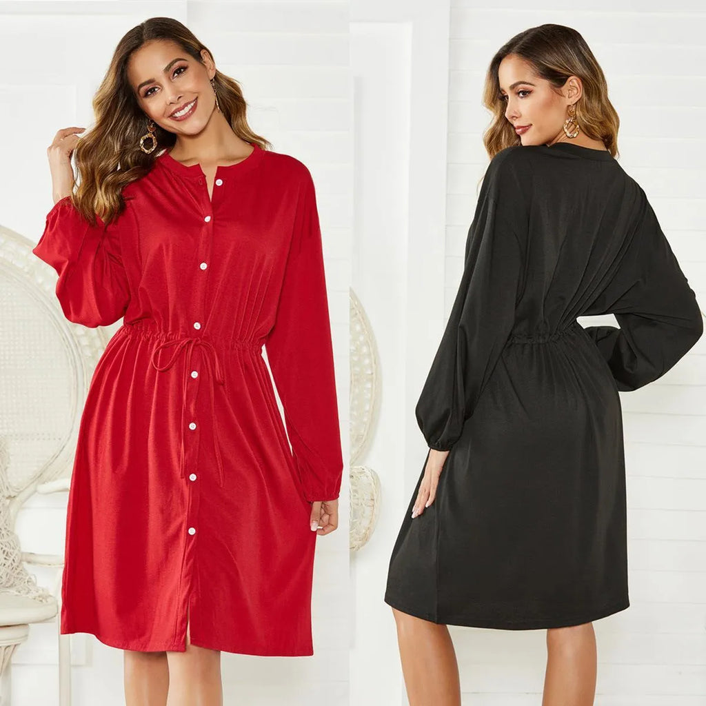 Black A-line midi dress with long sleeves, elastic waist, and a matching fabric belt.