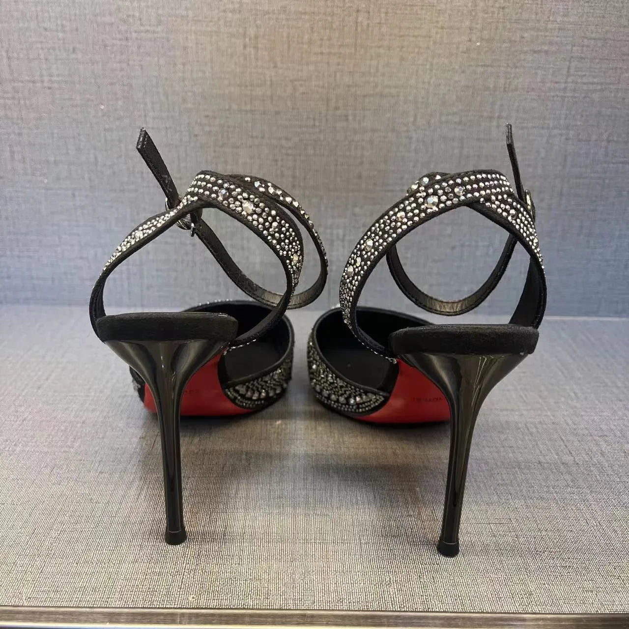 Women's hollow stiletto high heels with red sole and pointed toe design in black and silver options
