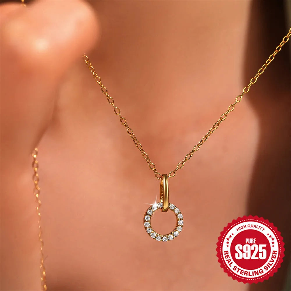 Gold-coloured S925 sterling silver geometric pendant necklace on a model, showing adjustable clasp.
