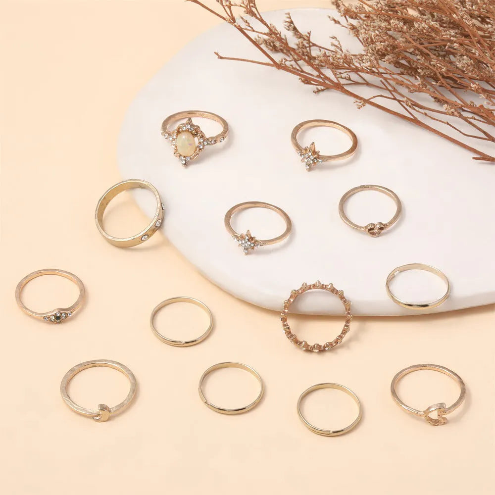 Vintage star moon rhinestone ring set of 13 pieces in gold and silver on display