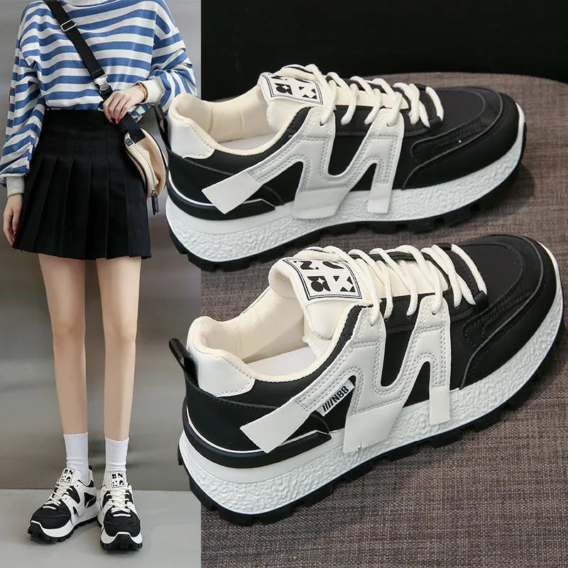 Artificial PU low top running sneakers in white and black colours with front lace-up design