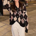 Casual knitted cardigan coat in a selection of colours including pink, green, and khaki, shown on a model.
