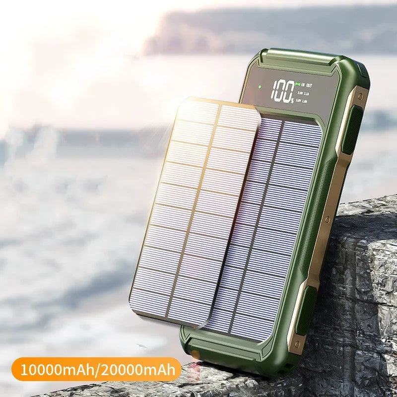 Black, green, and orange coloured large capacity mobile power bank showing size comparison.