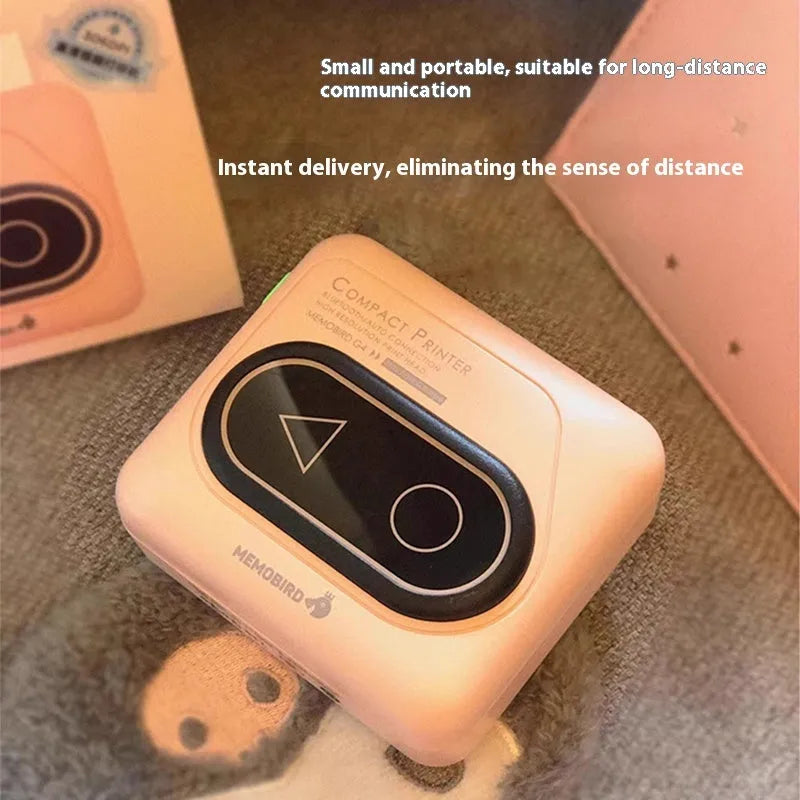 Compact Avocado Green Bluetooth mini thermal printer on a desk next to a mobile phone.