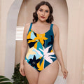 Conservative one-piece floral print swimsuit with spaghetti straps on a mannequin.