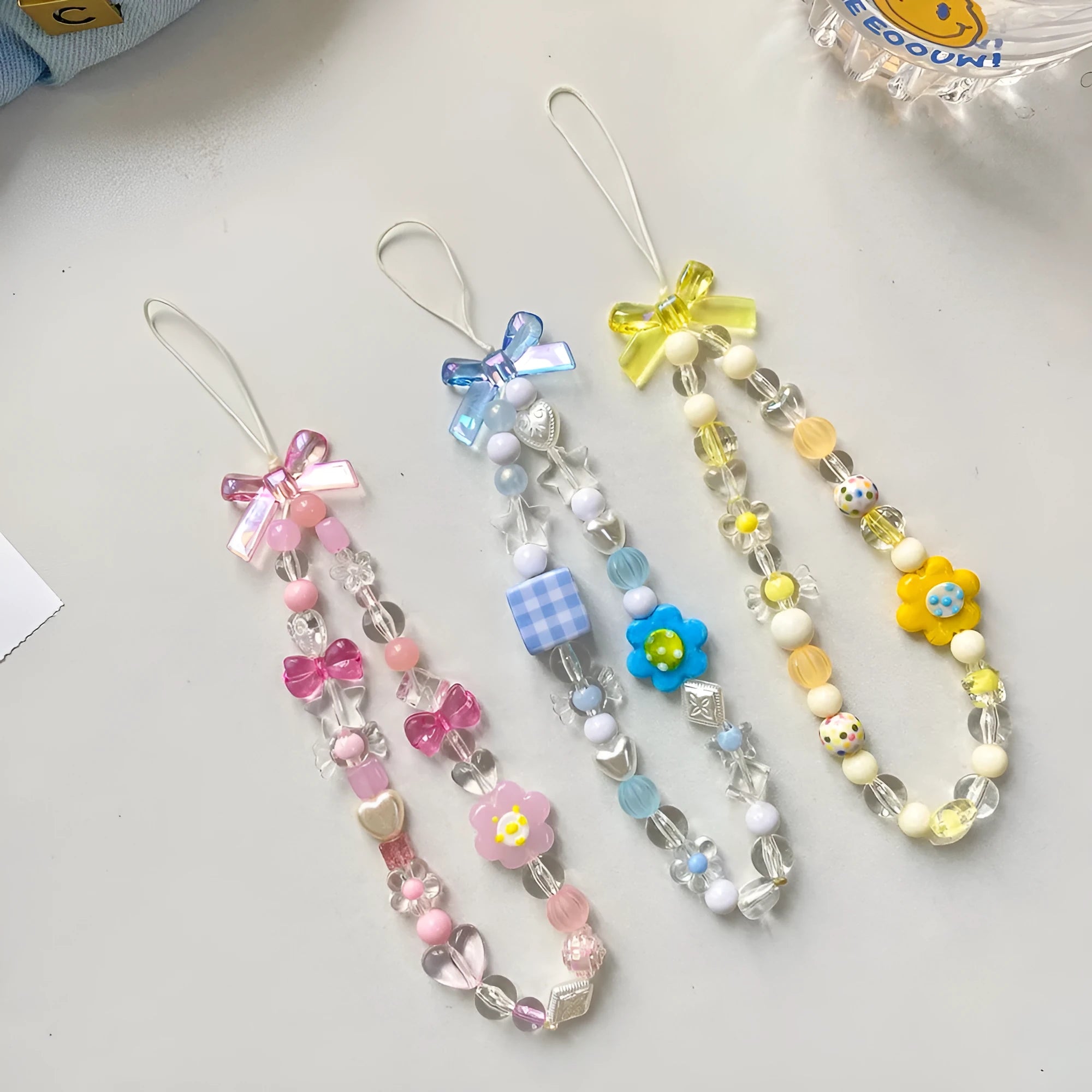 Floral beaded mobile phone lanyard in blue, pink or yellow colour options