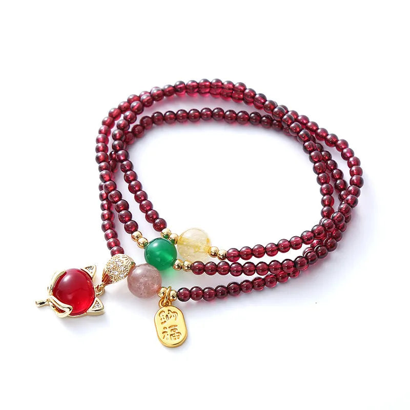 Purplish red garnet fox bracelet with adjustable rope closure and nature-inspired charm