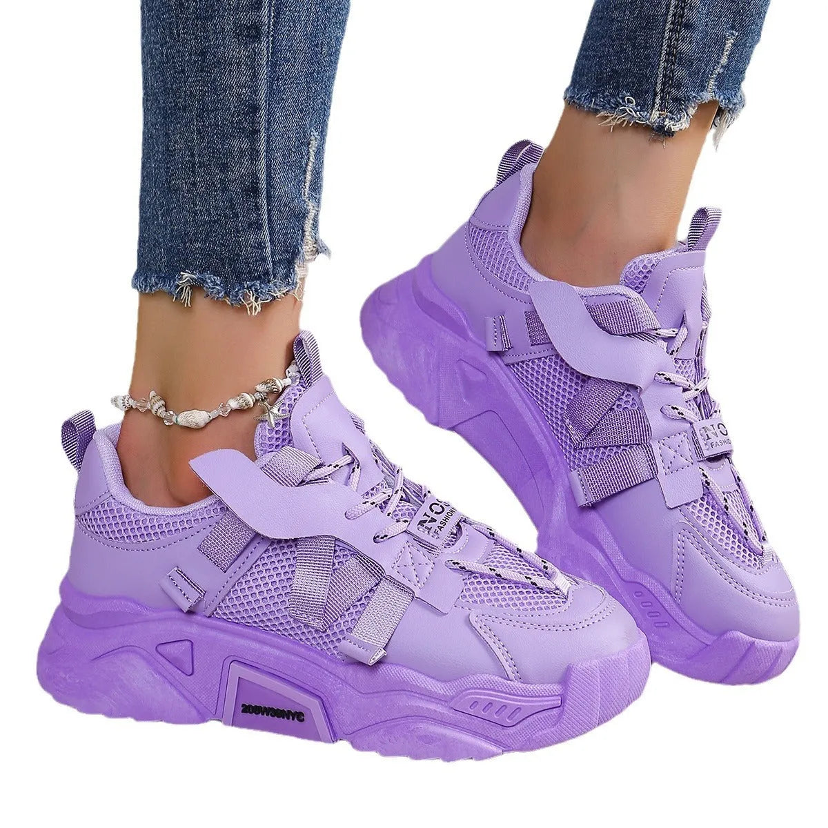 Women's purple platform mesh sports trainer with lace-up front on a white background.