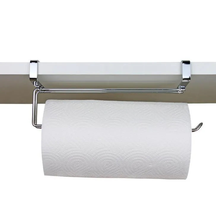 Silver stainless steel paper towel rack hanging on a kitchen cabinet door.