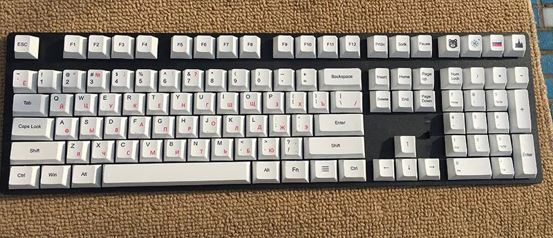 PBT thermal sublimation keycap set showing Japanese Russian Korean multilingual layouts with colour options
