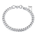 Geometric six-sided Cuban link metal bracelet in gold colour on a wrist.