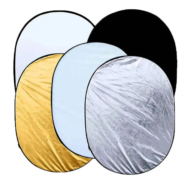 5-in-1 collapsible photography light reflector unfolded showing gold, silver, white, black, and translucent surfaces.