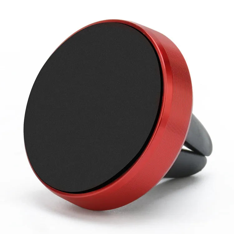 Magnetic car phone holder in rose gold attached to a car air vent
