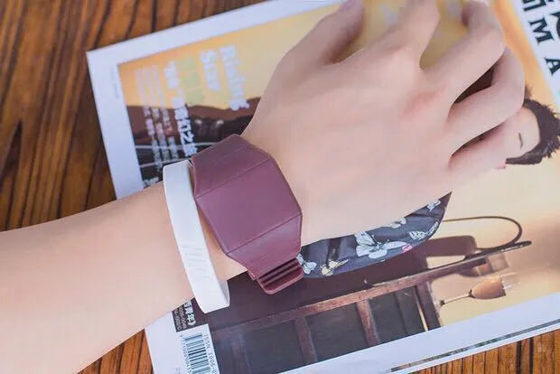 Square digital electronic watch with touch screen on a coloured PU strap, showing a number display with calendar.