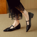 Brown women's cowhide leather low-cut flat shoes with a round toe and soft bottom.
