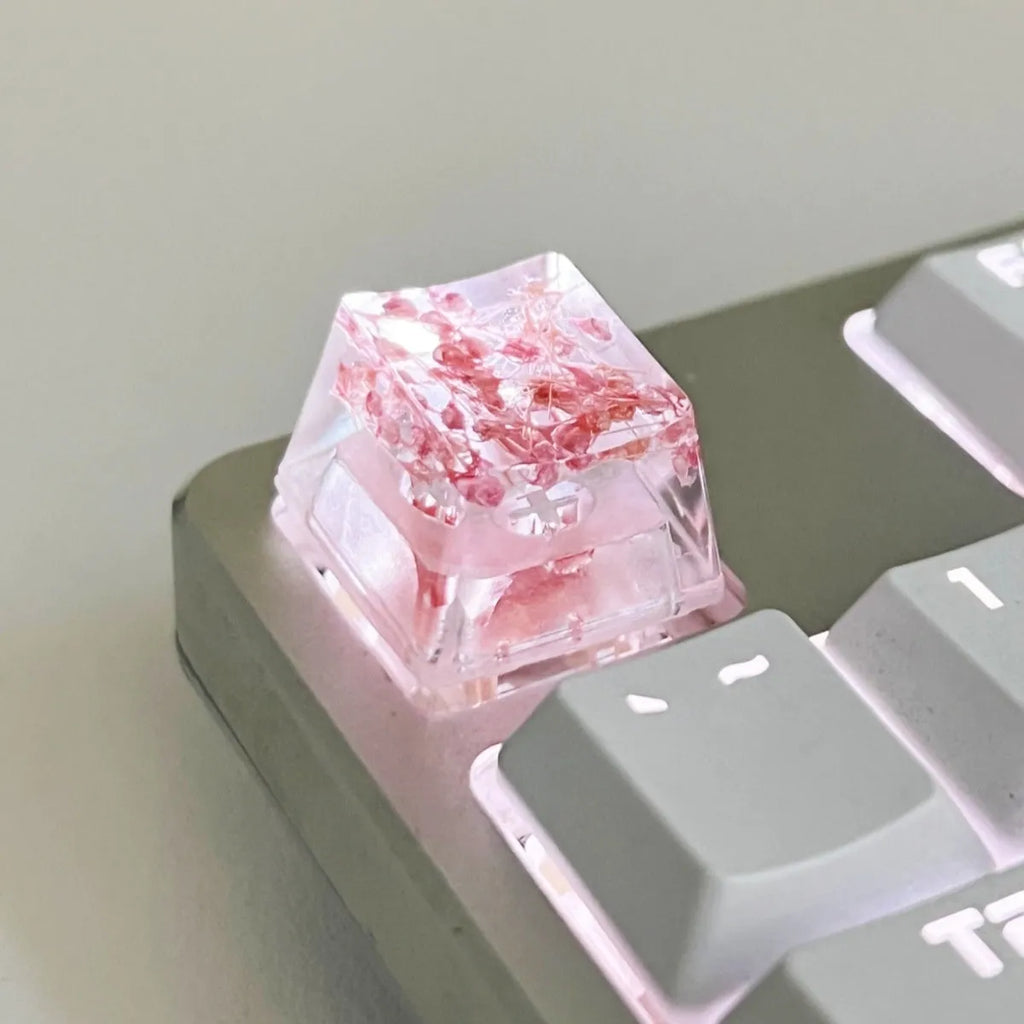 Transparent resin mechanical keyboard keycap with starry sky design in one of four colour options