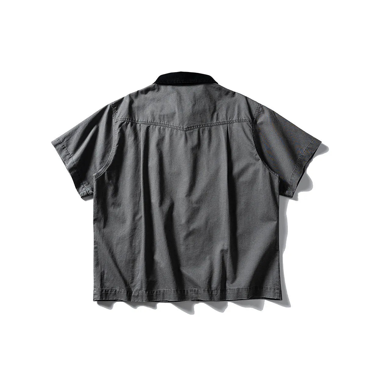Short sleeve washed cotton overalls shirt in loose cardigan style, khaki colour, on hanger