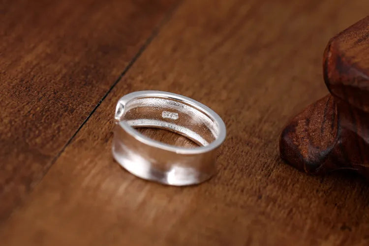 Geometric open ring in frosted sterling silver with adjustable opening