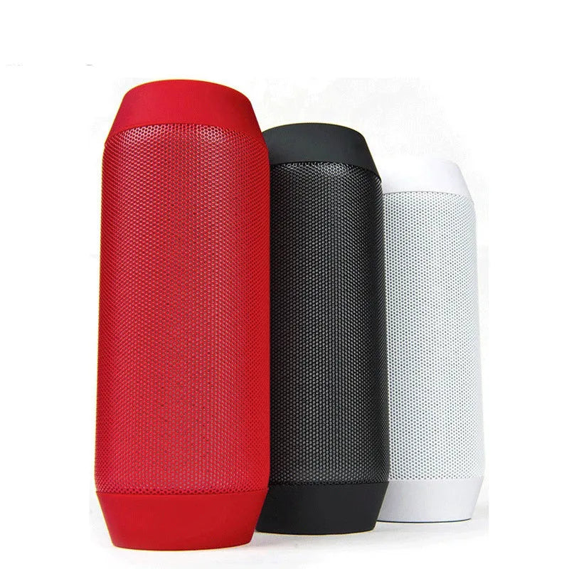 Mini black and white Bluetooth stereo speaker with colourful LED lights on a table.