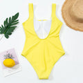 Ladies one-piece zipper printed nylon swimsuit in white with full front zip, side view on model