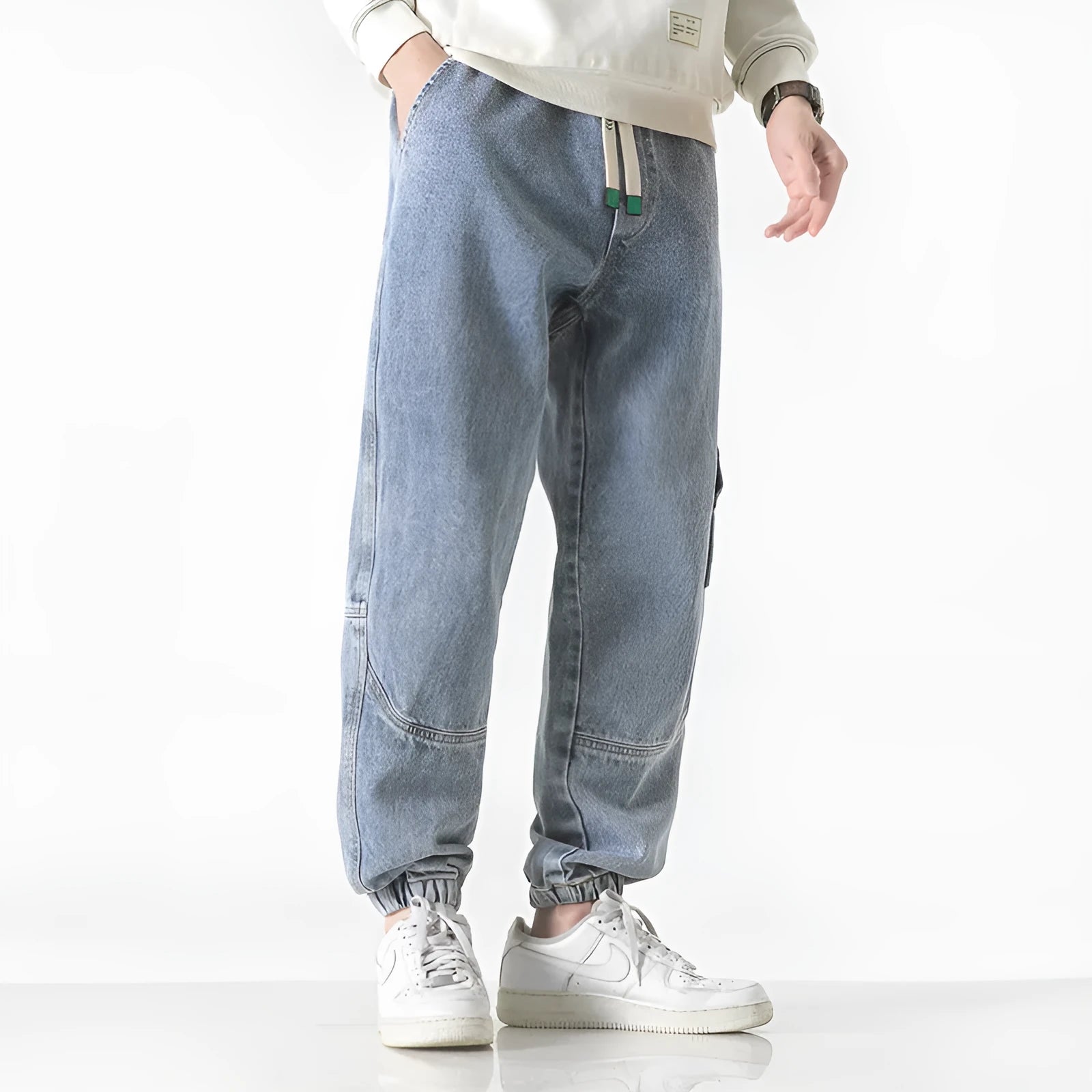 Men's loose-fit tapered cotton trousers in black, blue, or grey with mid waist design