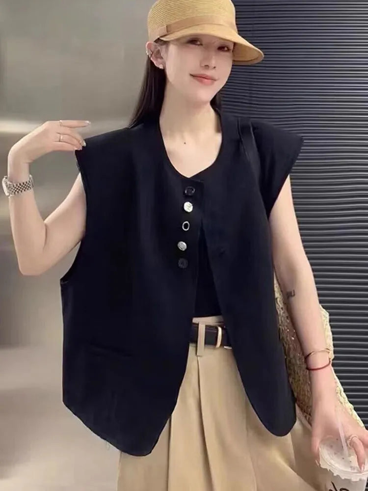 Women's loose fit polyester vest in milky white colour with pockets, shown on hanger