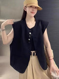 Women's loose fit polyester vest in milky white colour with pockets, shown on hanger