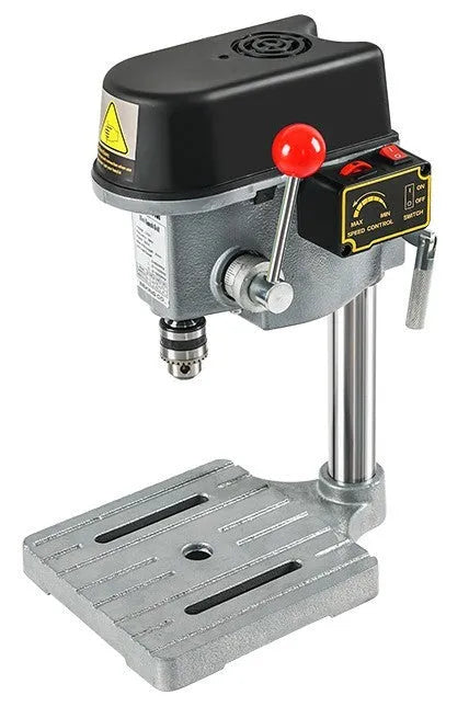 Mini bench drill and milling machine with included 1050W drill and metal bench pliers on a workbench.
