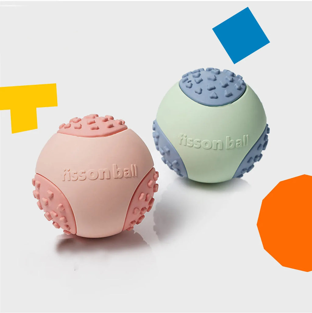 Green and pink rolling ball dog toy with 64mm diameter for interactive motion play