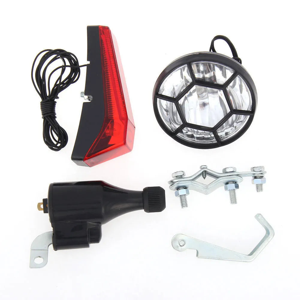 Silver bicycle dynamo generator light mounted on bicycle frame for friction-powered front and rear illumination