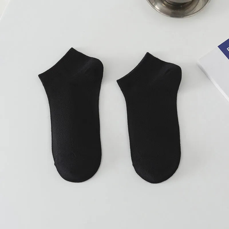 Men's solid colour low-cut polyester boat socks shown in one of six available colour variants.