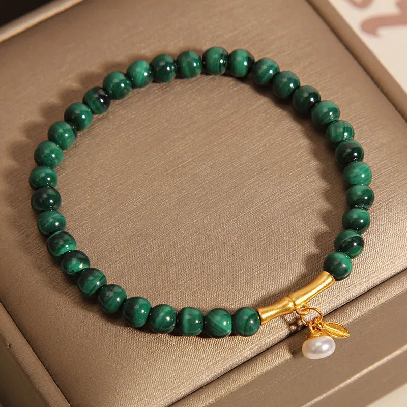 White crystal lucky bamboo bracelet for women, showing high-rise design on wrist.
