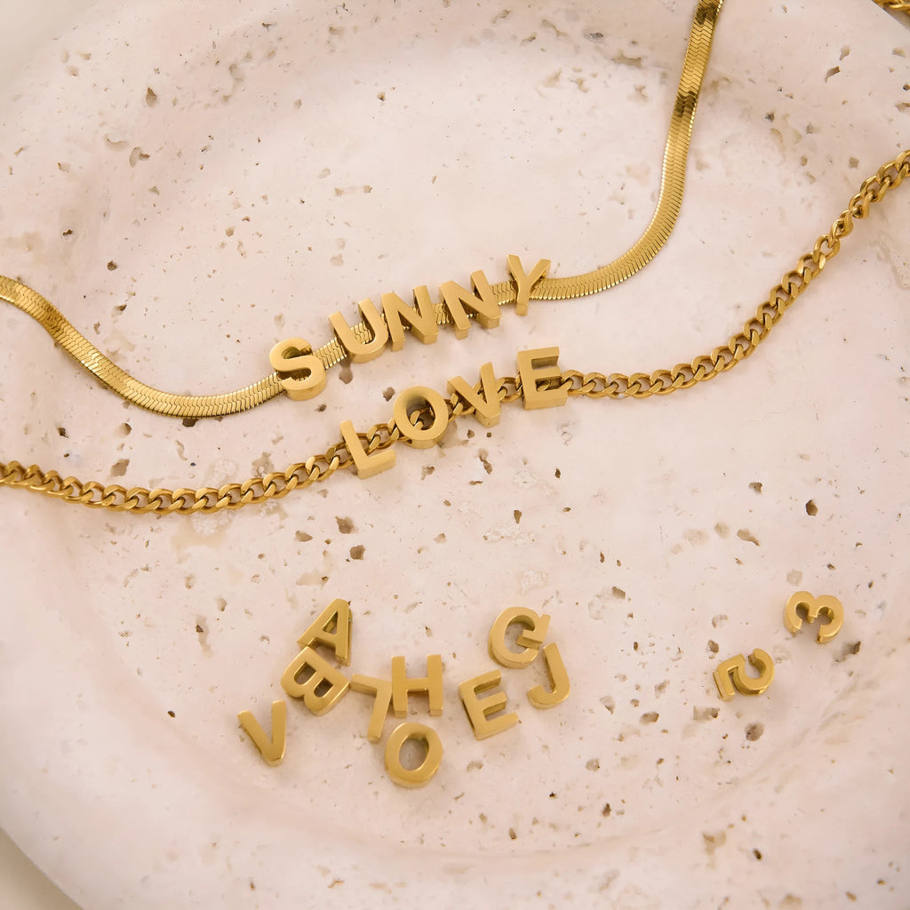 Personalised titanium steel necklace with a letter charm on a 40.5cm electroplated chain.