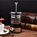 350ml capacity glass and stainless steel manual coffee maker, 10cm wide by 17cm tall.